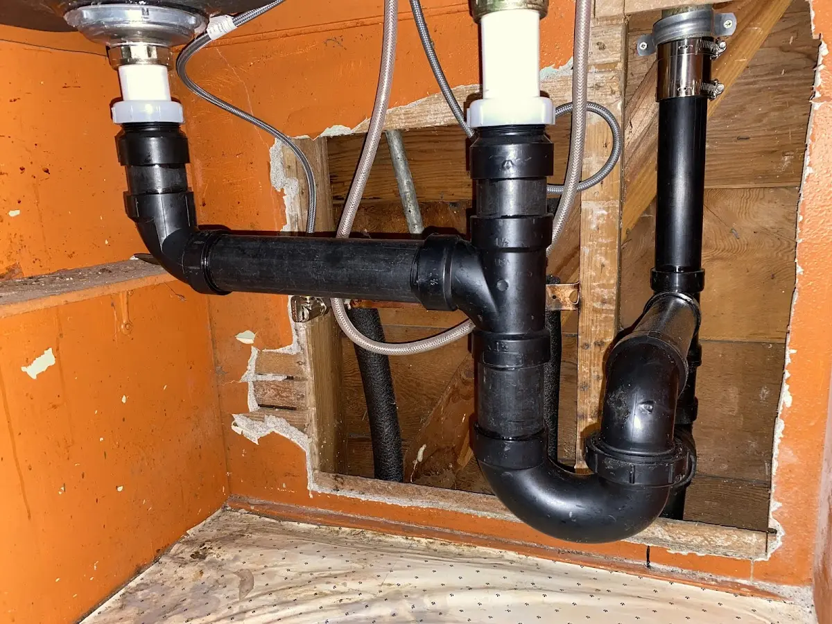 Professional Garbage Disposal Repair equipment and tools on the job in Summit